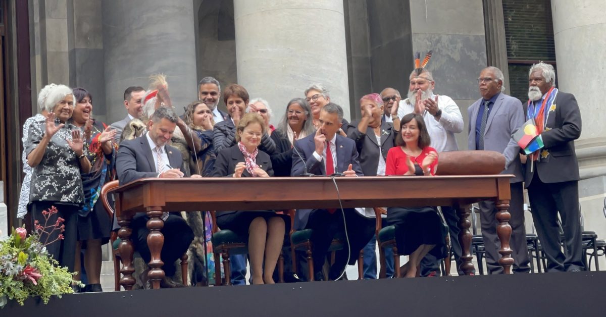 group of people at a government signing ceremony