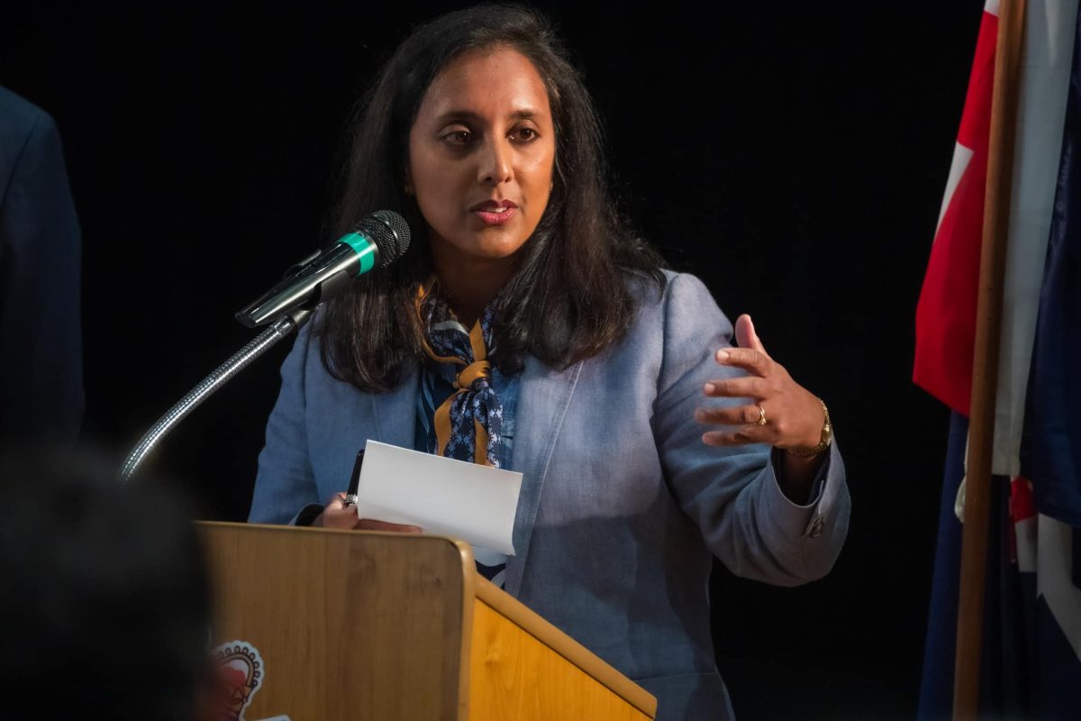 Higgins MP Dr Michelle Ananda-Rajah speaking from a lectern.