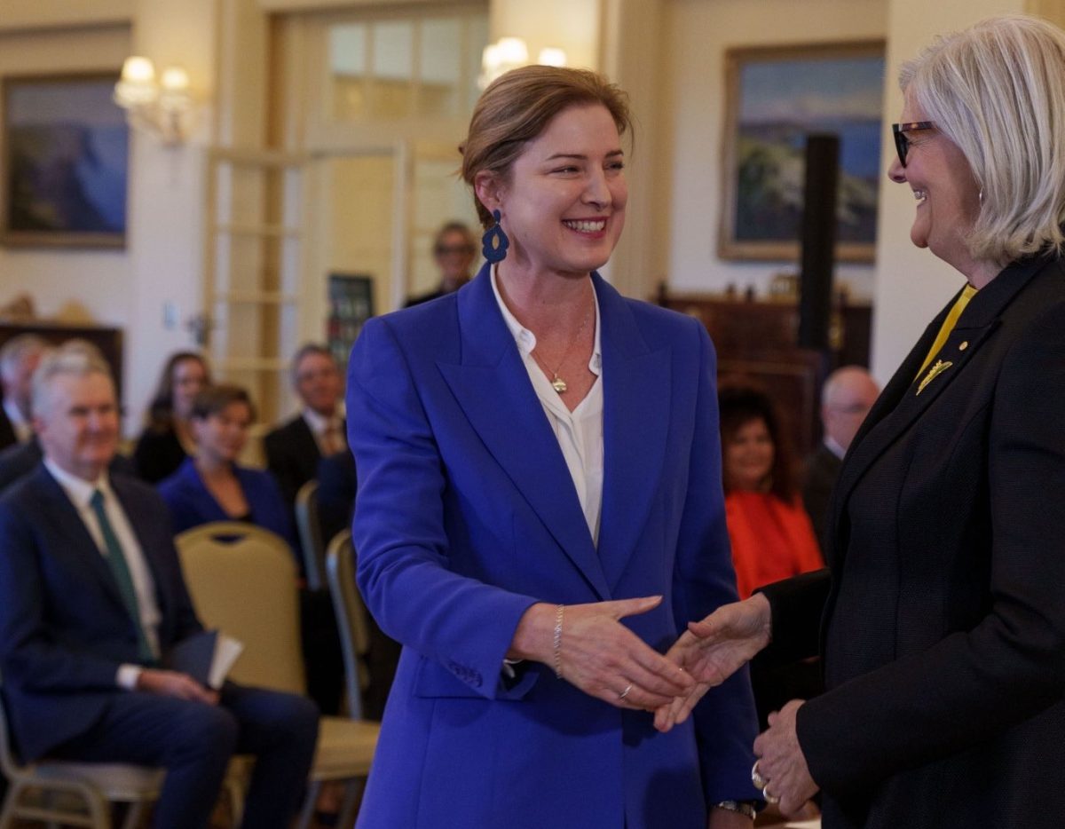 Julie Collins shaking hands with Governor-General Sam Mostyn.