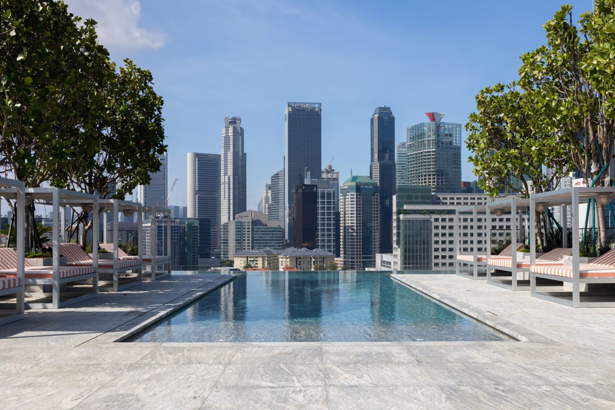 hotel infinity pool with CBD backdrop