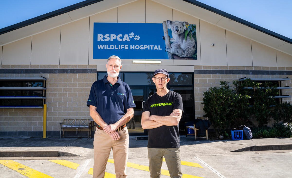 Two men standing in front of a wildlife hospital