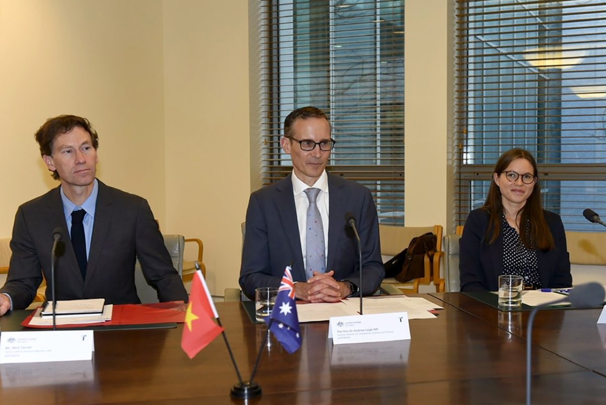 three government officials at a table