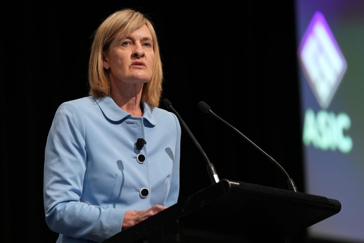 woman speaking at lectern