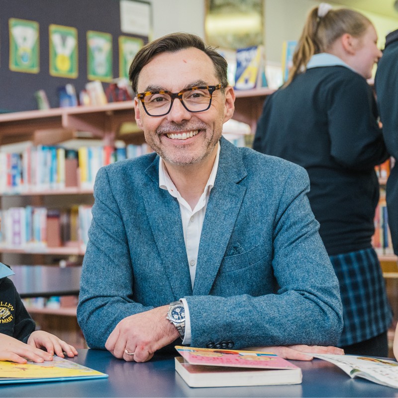 smiling man in library