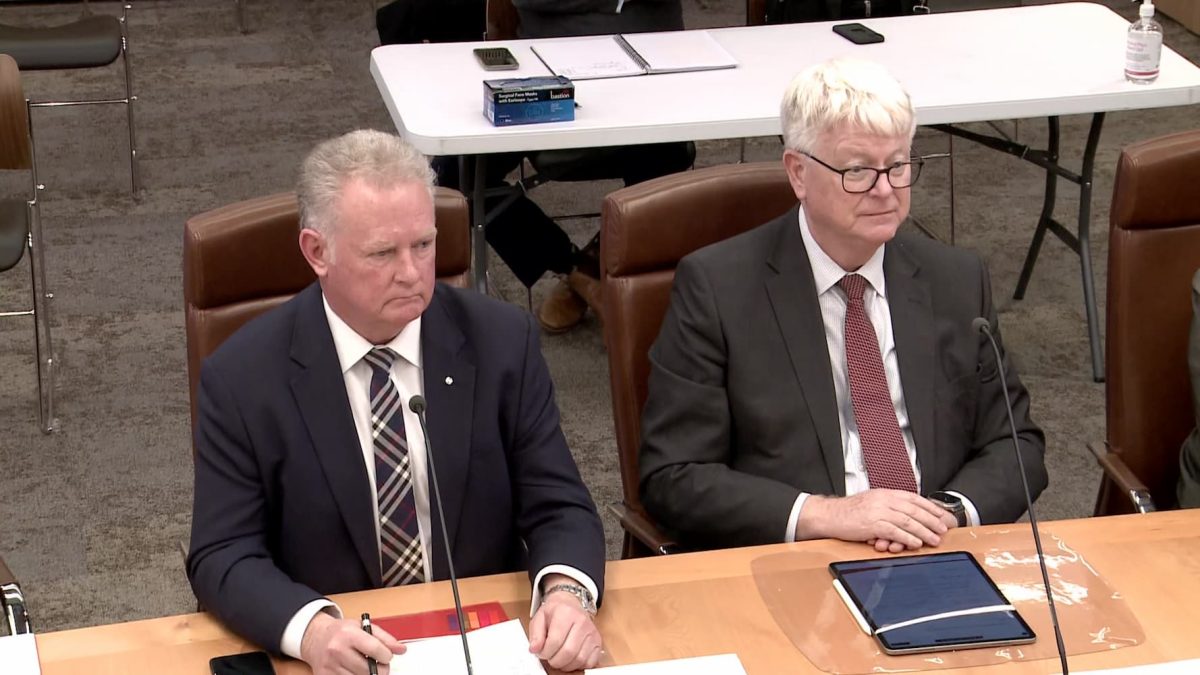 Michael Grainger and Bernard Dwyer sitting in front of the Public Accounts Committee