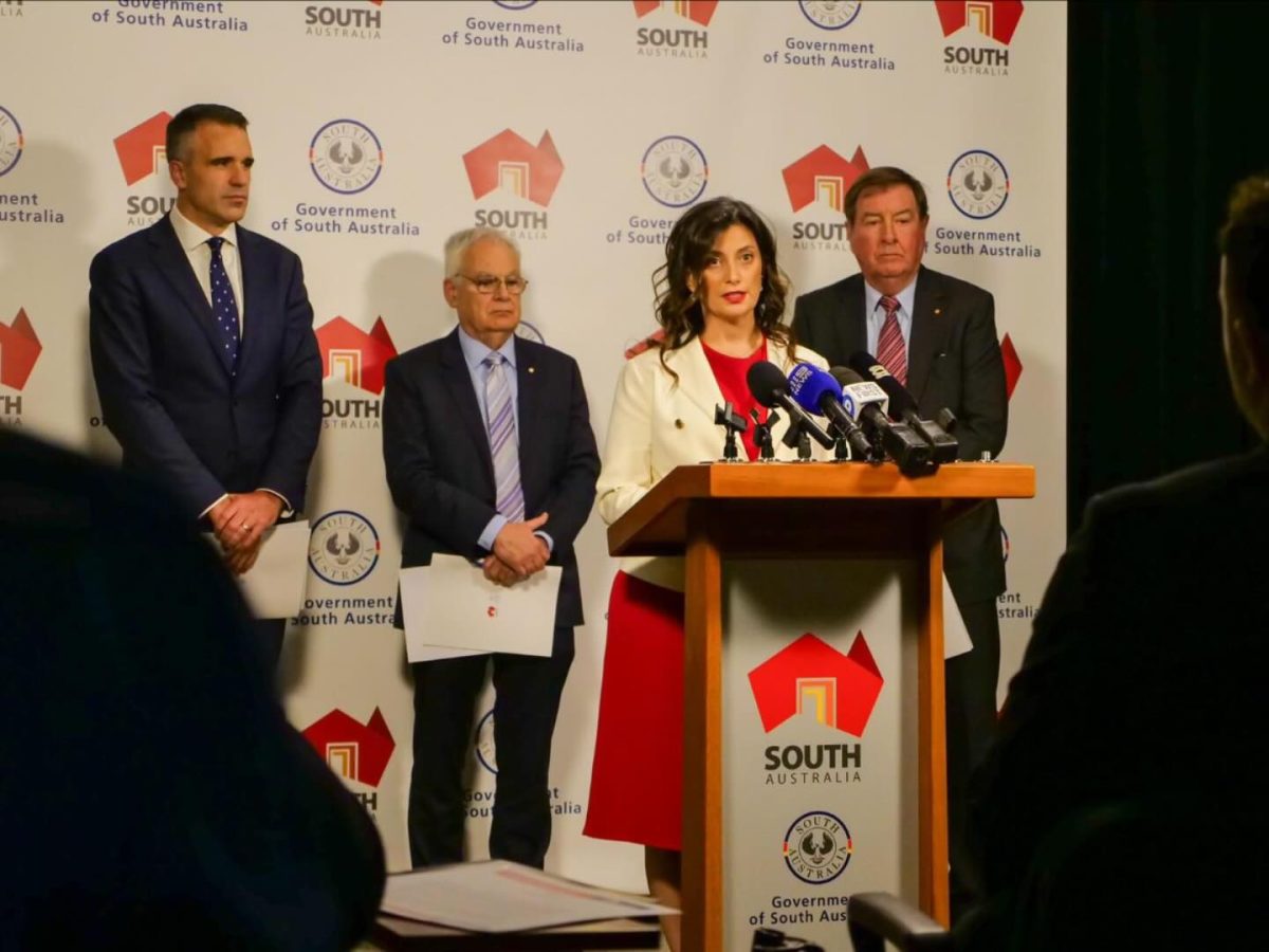 Andrea Michaels MP speaking at a press conference with Premier Peter Malinauskas and two others behind her.