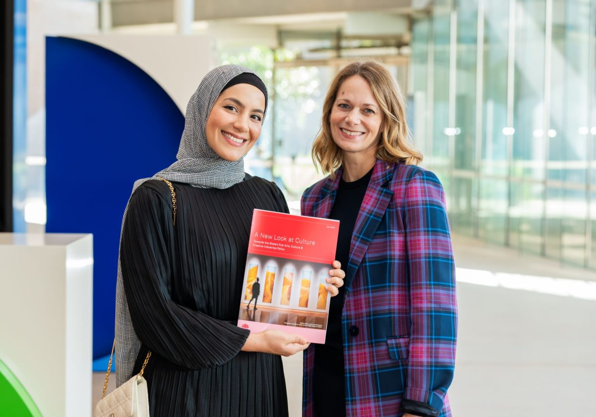 two women and a booklet