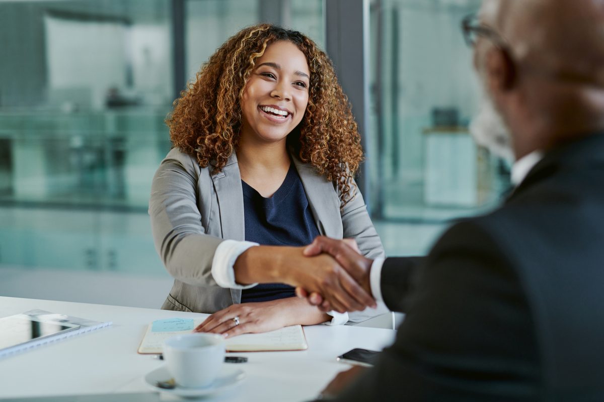 Happy woman shaking hands