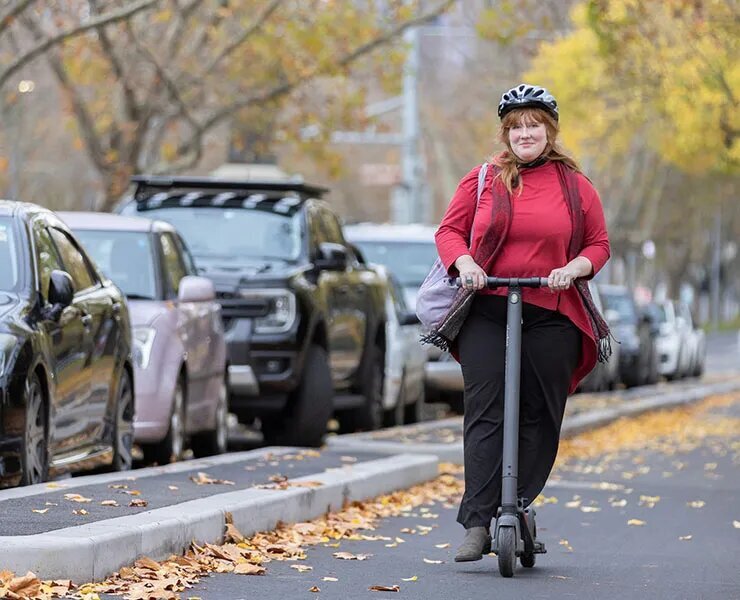 woman riding escooter