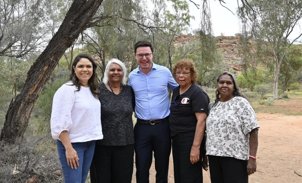 Jacinta Price and David Littleproud standing outside with three Indigenous women.