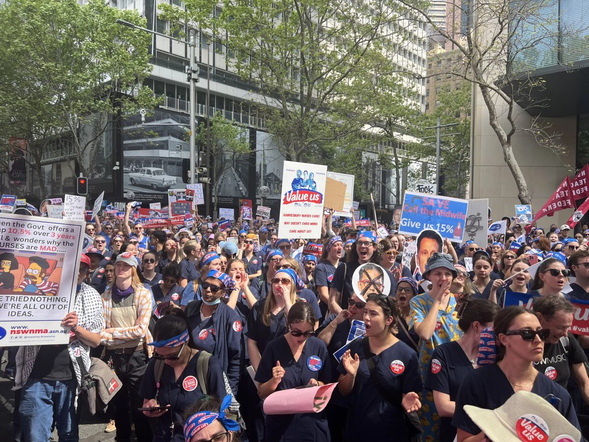 A large crowd of nurses and midwives protesting outside the NSW Parliament House