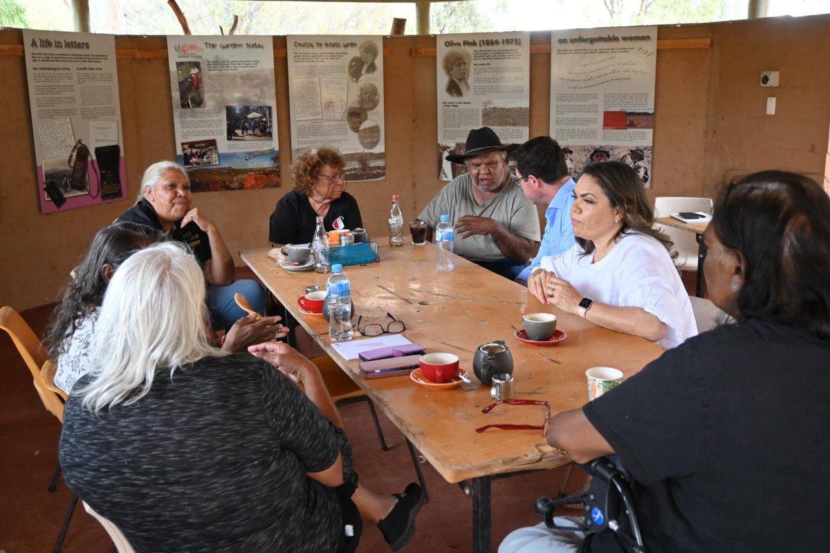 Jacinta Price and David Littleproud speaking with members of the Alice Springs Town Council over at a table.