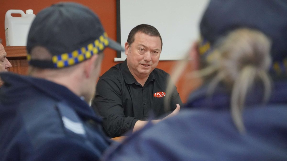 man speaking with government officials