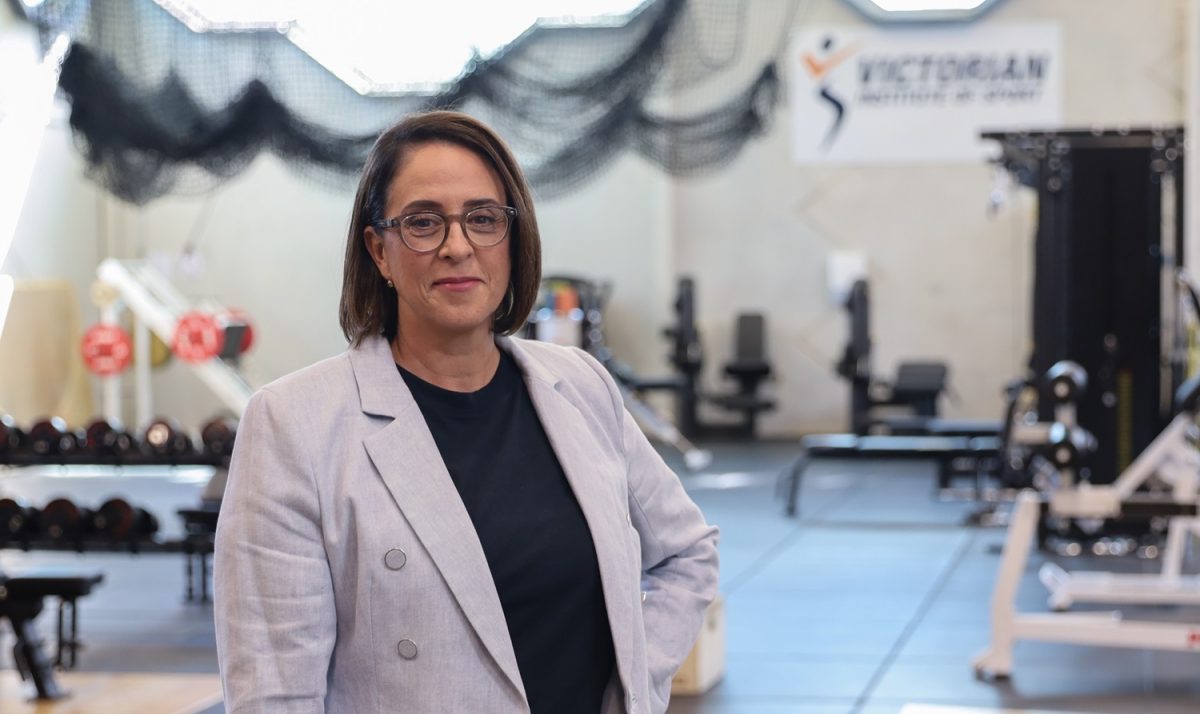 a woman standing in a gym