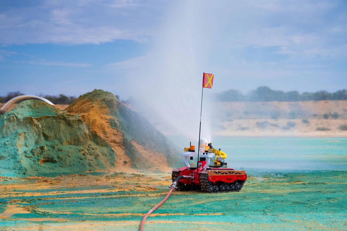 Drone using a fire hydrant on a sand hill in a test zone