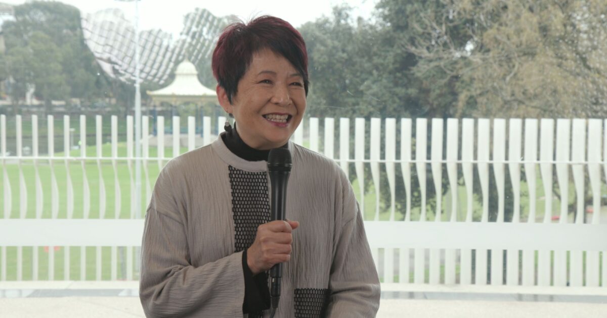 woman speaking on microphone