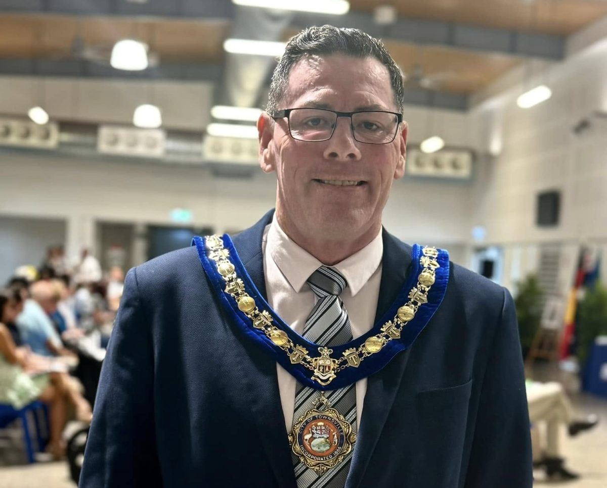 Man with a mayoral medal around him