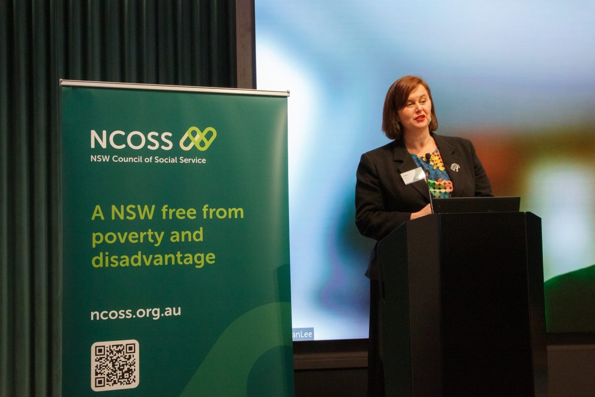 a woman speaking at a lectern