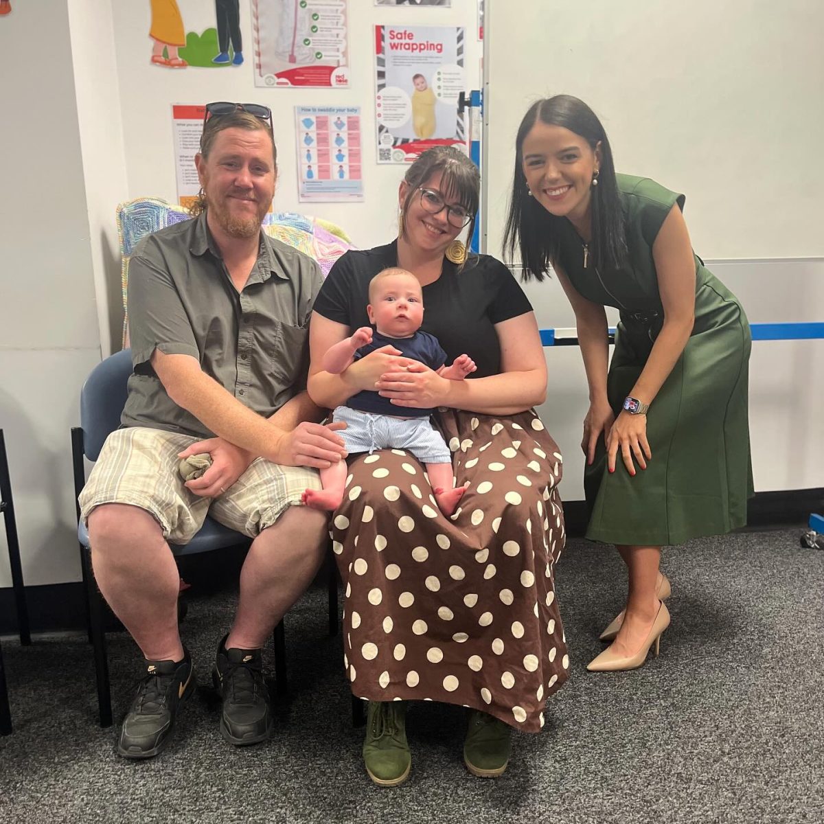 Olivia Savvas, two parents and the mum is holding a baby.