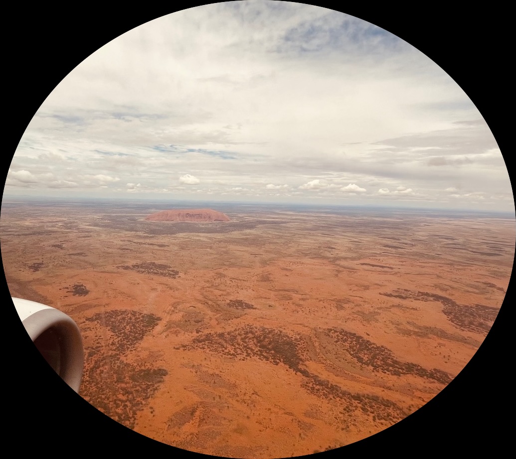 an aerial view of a monolith and its surrounding terrain