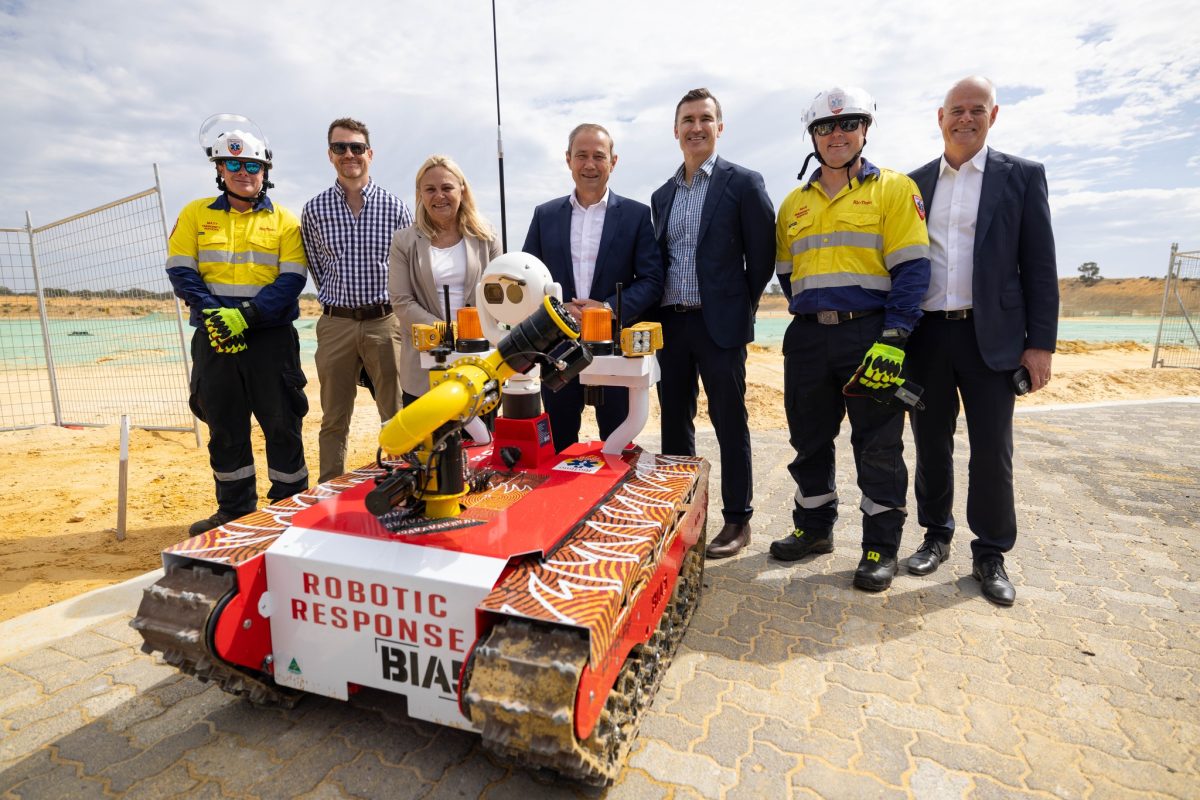 a group of people with a robot 