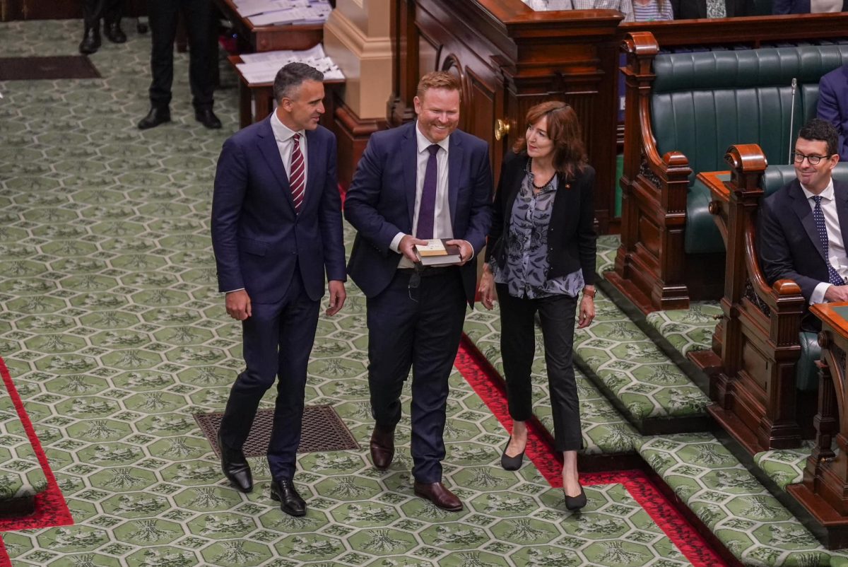 Premier Peter Malinauskas walking in SA Parliament with Member for Black, Alex Dighton.