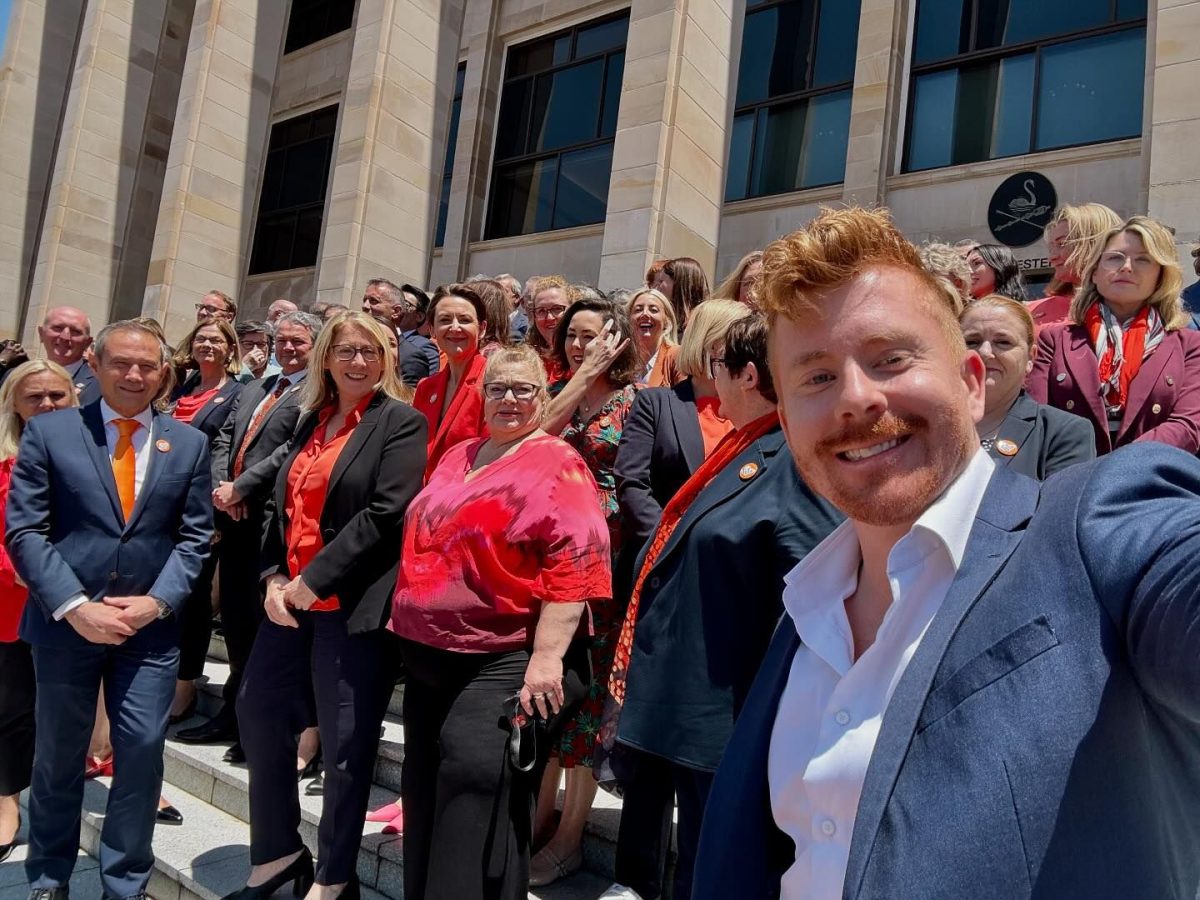 Wilson Tucker taking a selfie in front of WA Parliament with the rest of the Legislative Council.