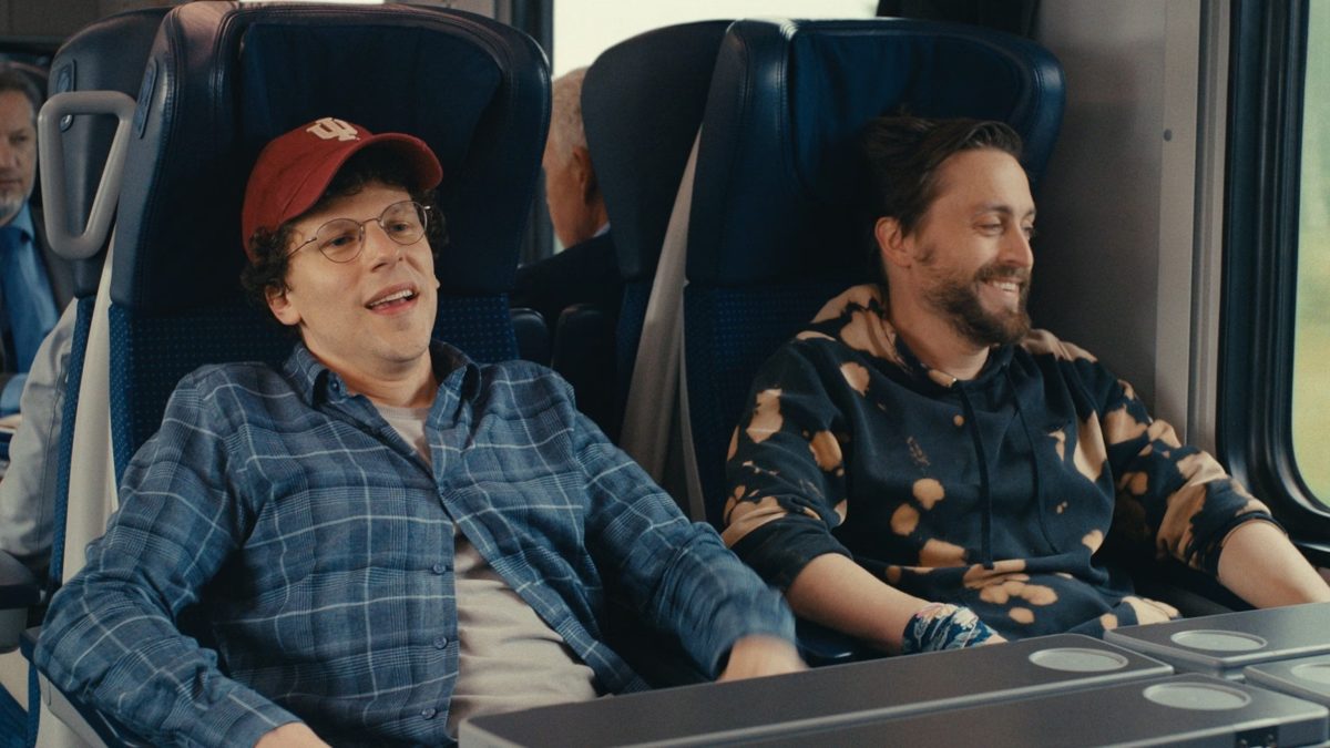 two men in a bus in a movie scene