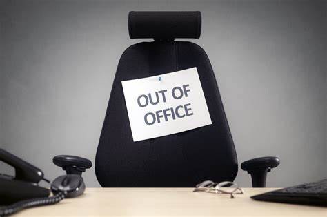 Out of Office sign on an office chair