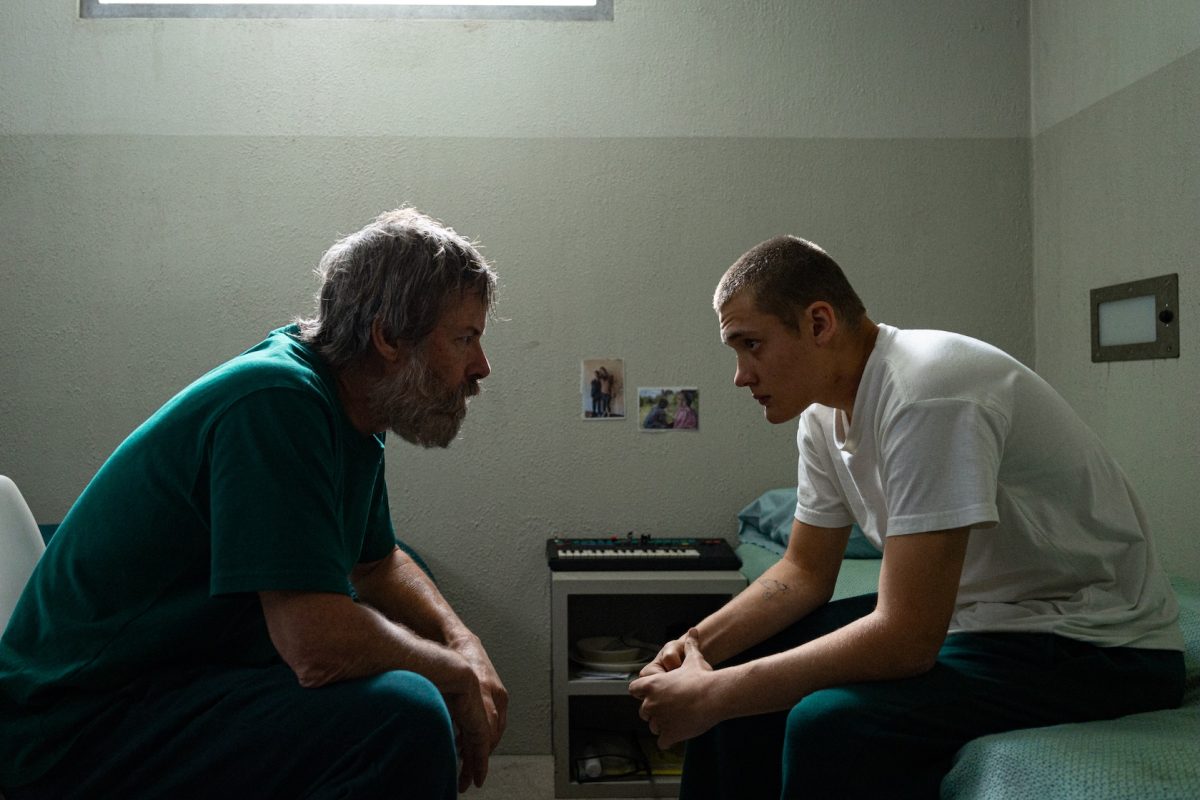 a movie still of two men in a jail cell