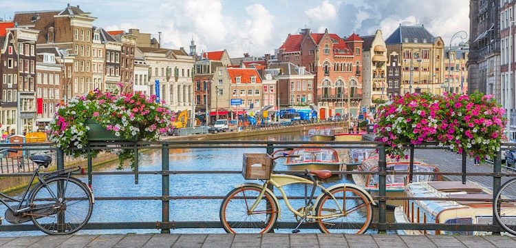 bicycles on a bridge on a city canal