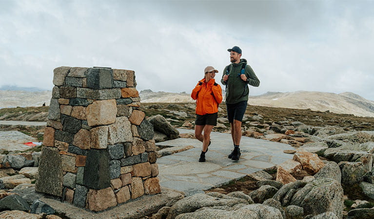 a woman and a man on an alpine walk