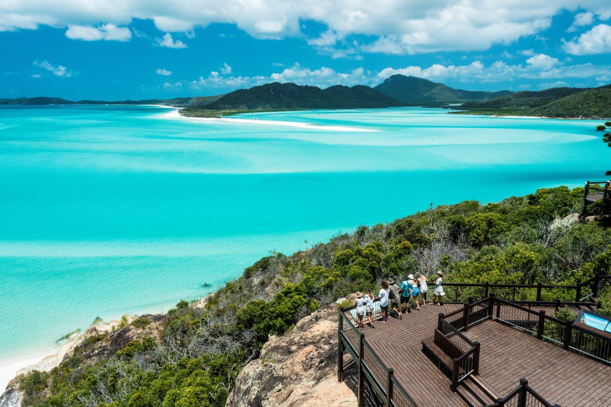 people at a lookout admiring the sea