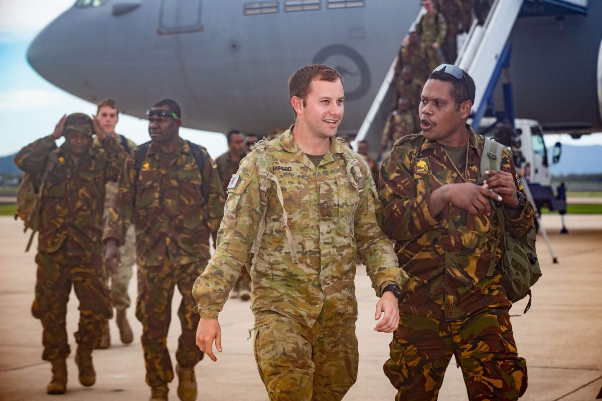 ADF members with Pacific nation troops at an airport