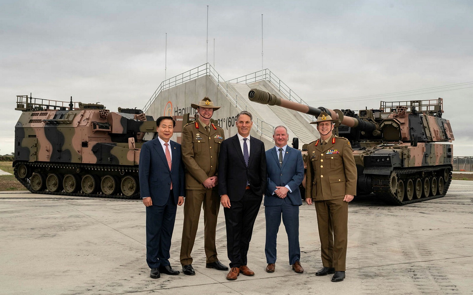 Korean Ambassador to Australia Admiral Seung-Seob Sim, MAJGEN Richard Vagg, Defence Minister Richard Marles, Acting HDA MD Dean Michie, and MAJGEN Jason Blain. at the arrival of the vehicles at H-ACE. Photo: HDA