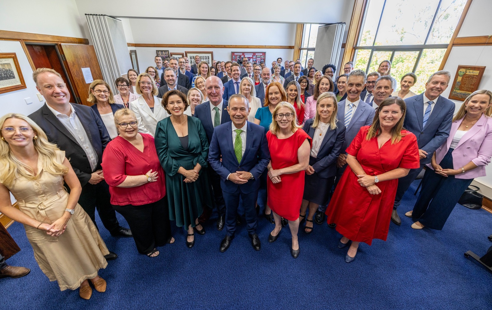 a group of office people in a large room