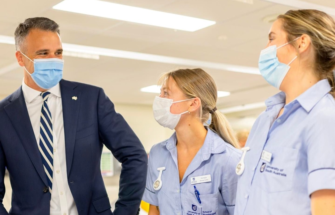 man with two female healthcare workers 