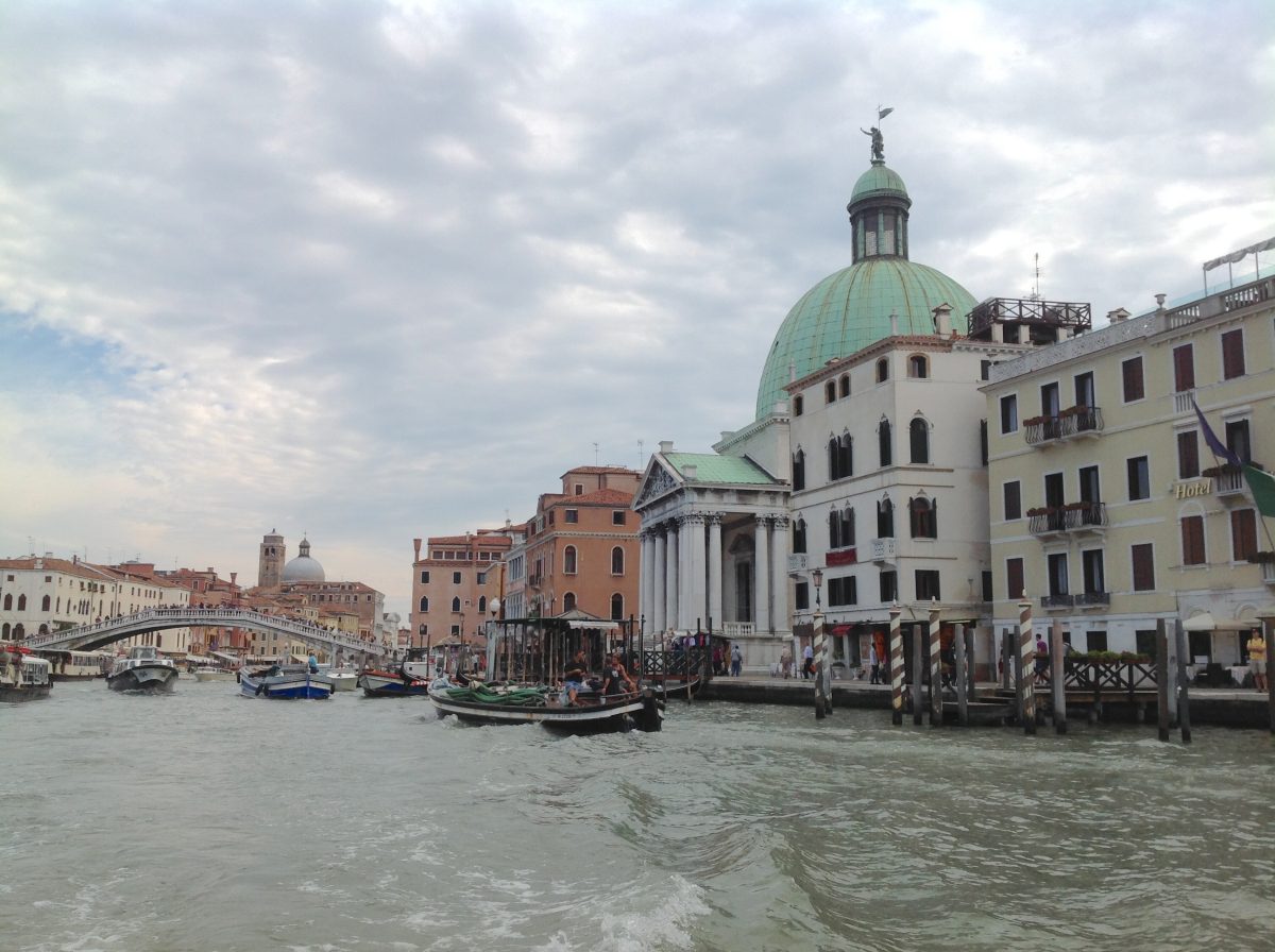 church on a canal in a city