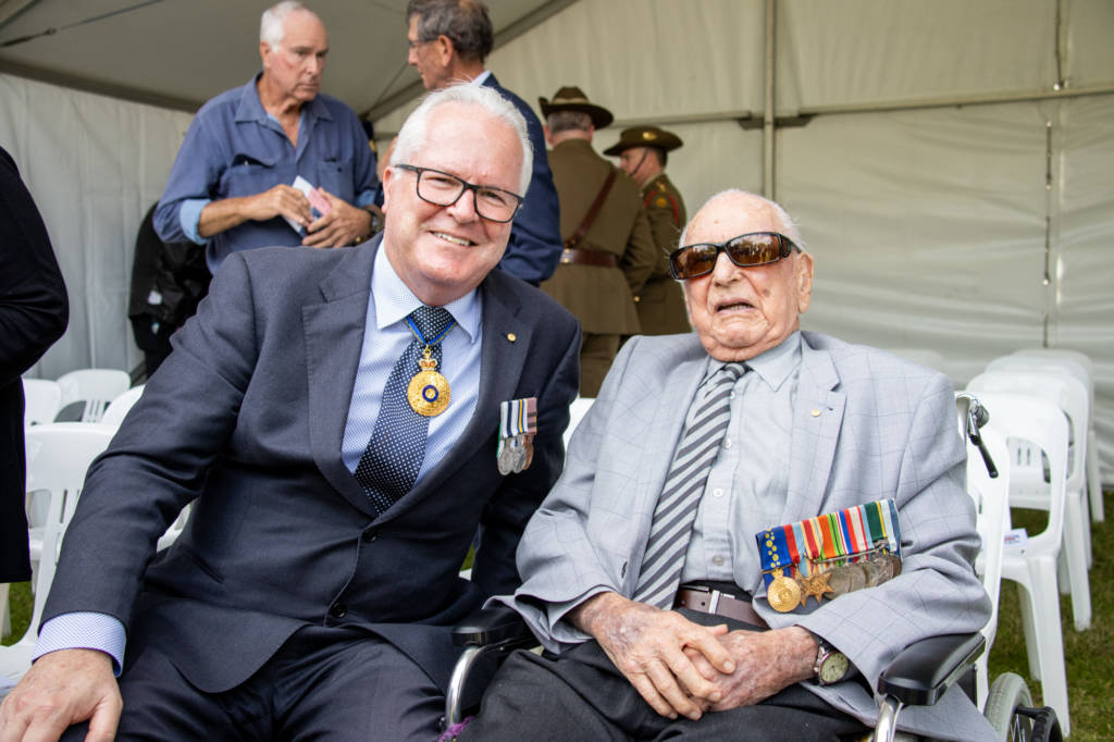 two men wearing military medals
