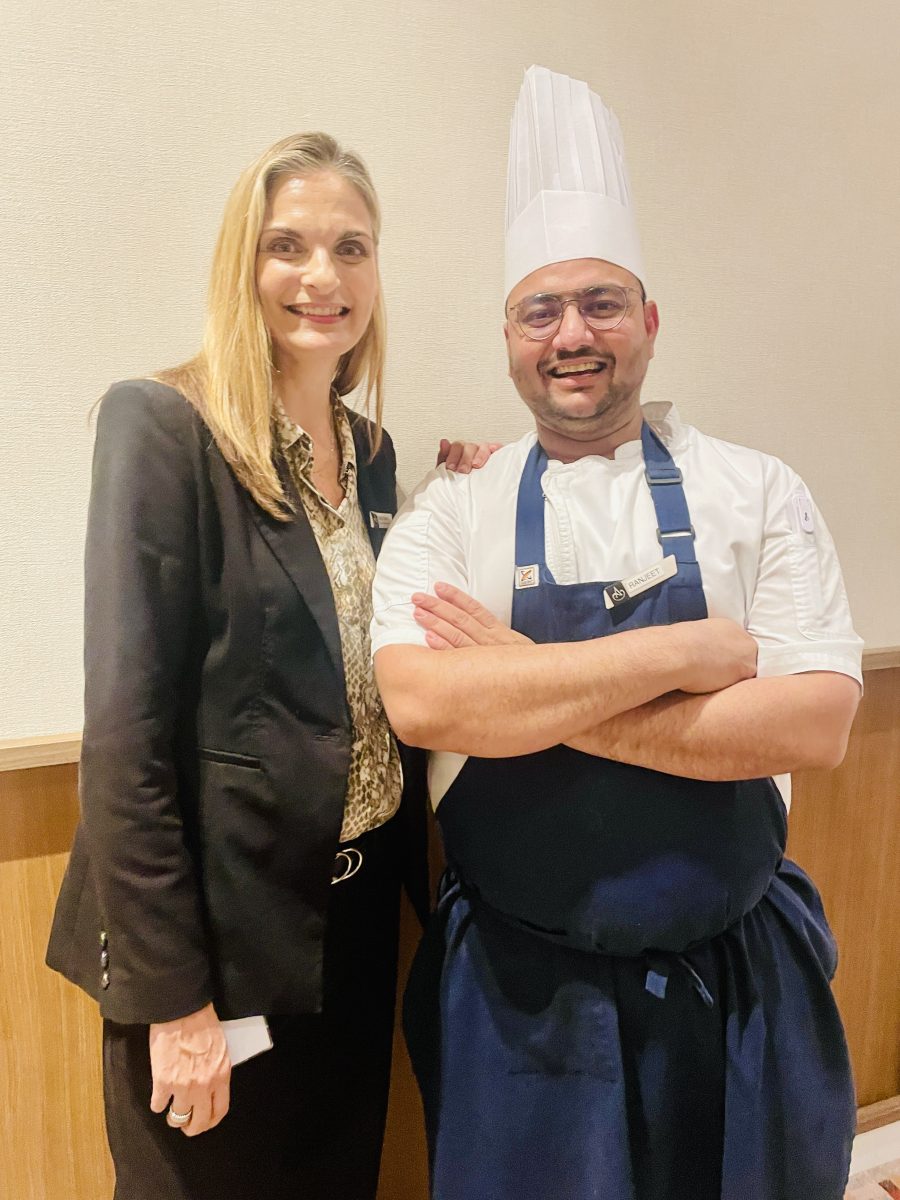 a woman and a male chef