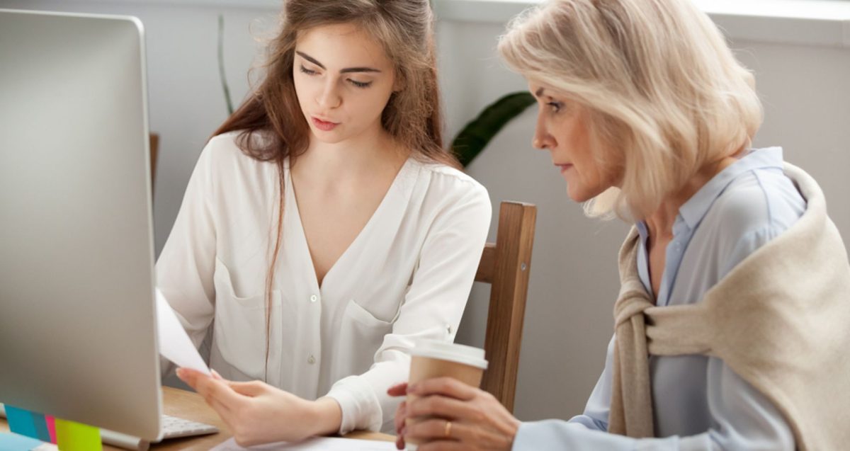 Younger woman getting advice from an older one