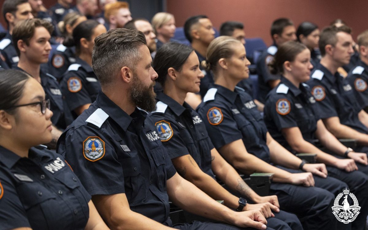 NT cops sitting in a hall