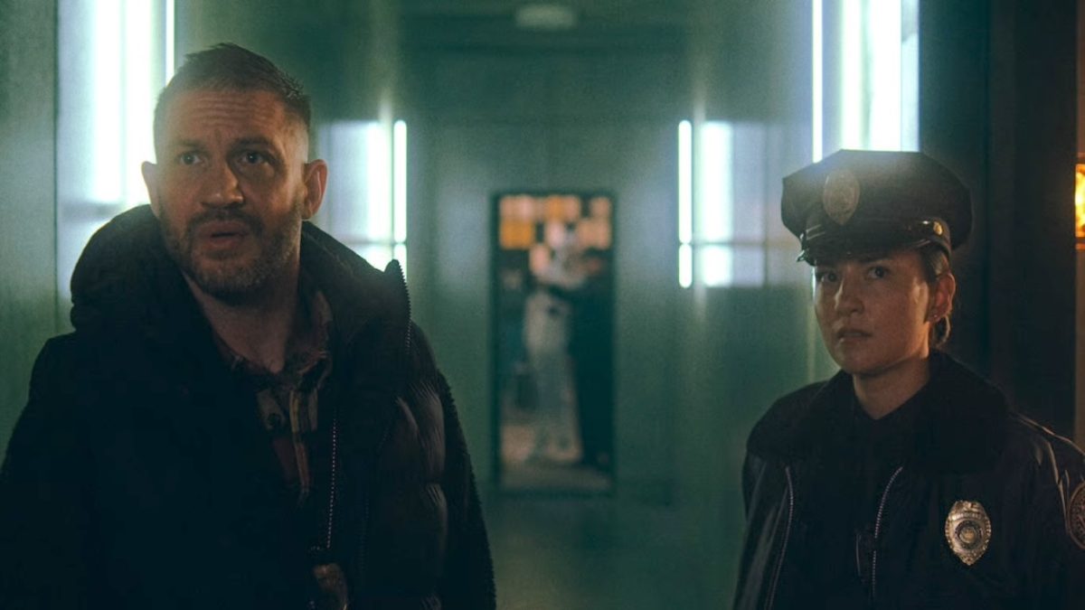 a man and a policewoman in a movie scene