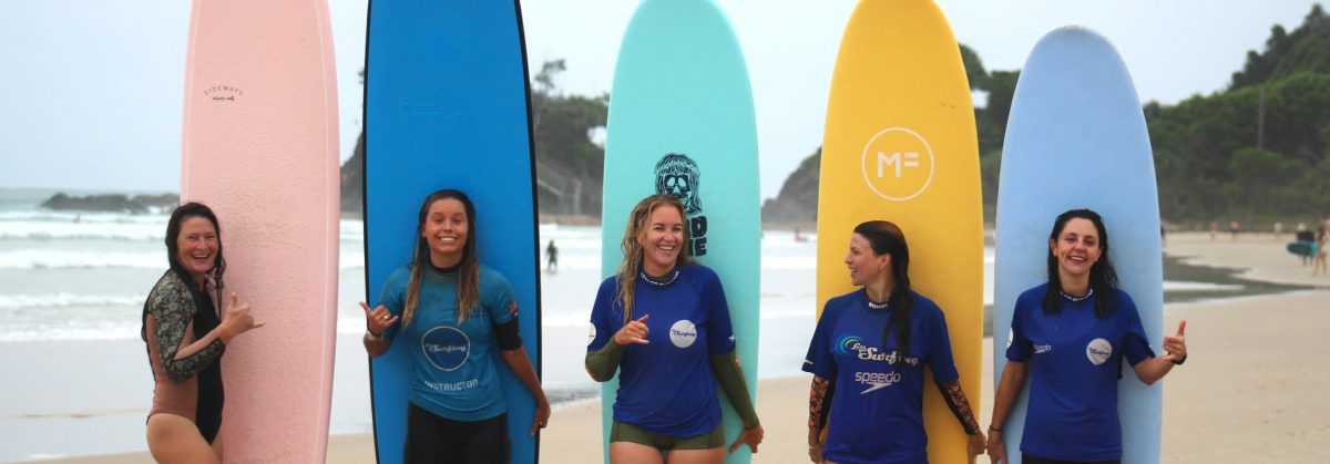 women with surfboards