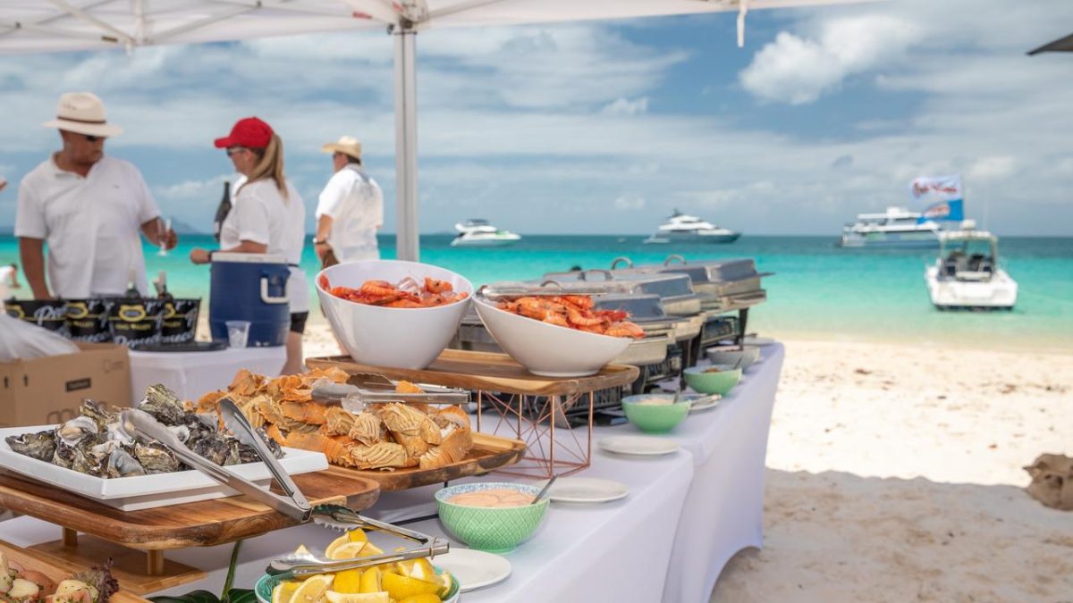 The White on Whitehaven long lunch is one event that transforms the world-famous Whitehaven Beach into an oceanfront pop-up restaurant — complete with white marquees, champagne and seafood feasts.