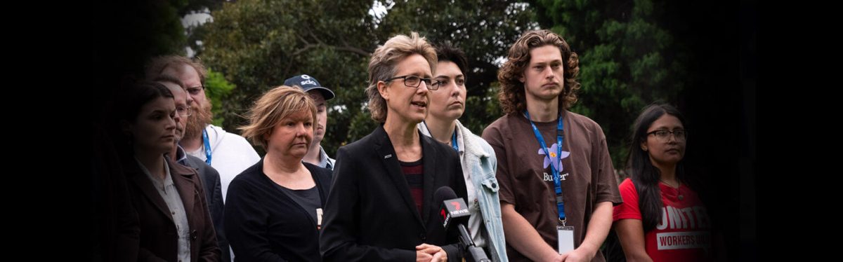 woman giving an outdoor press conference