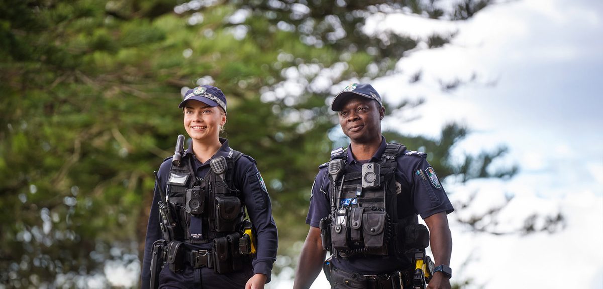 two Queensland police officers walking