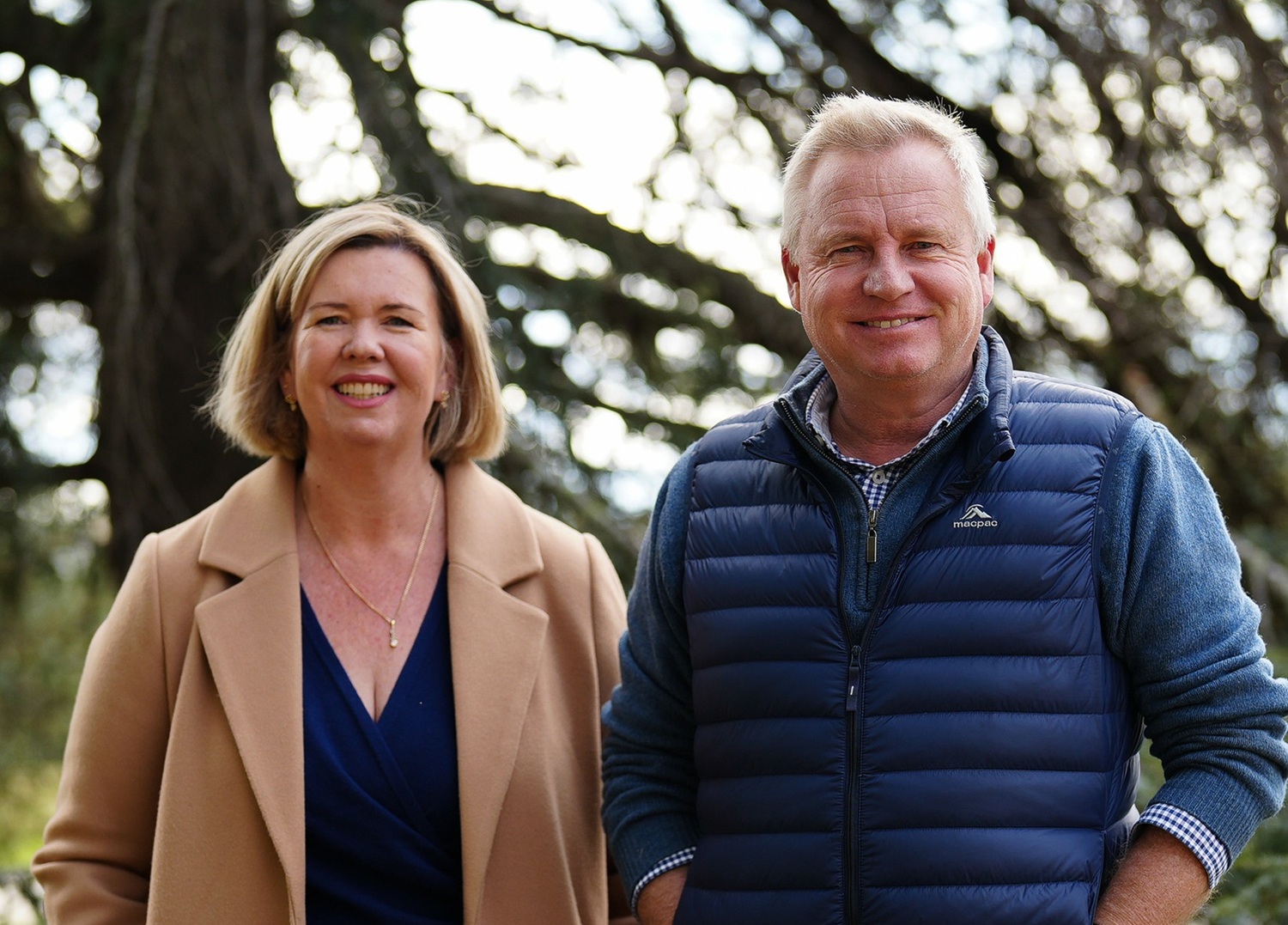 a smiling woman and a smiling man