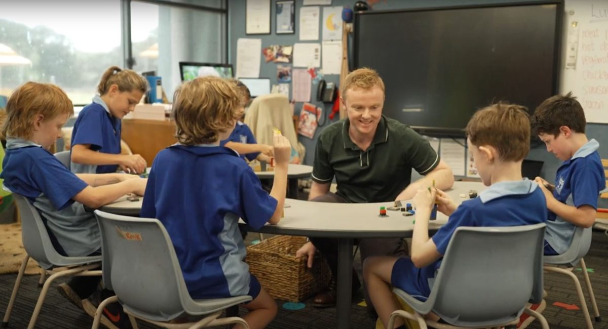teacher in a classroom with students