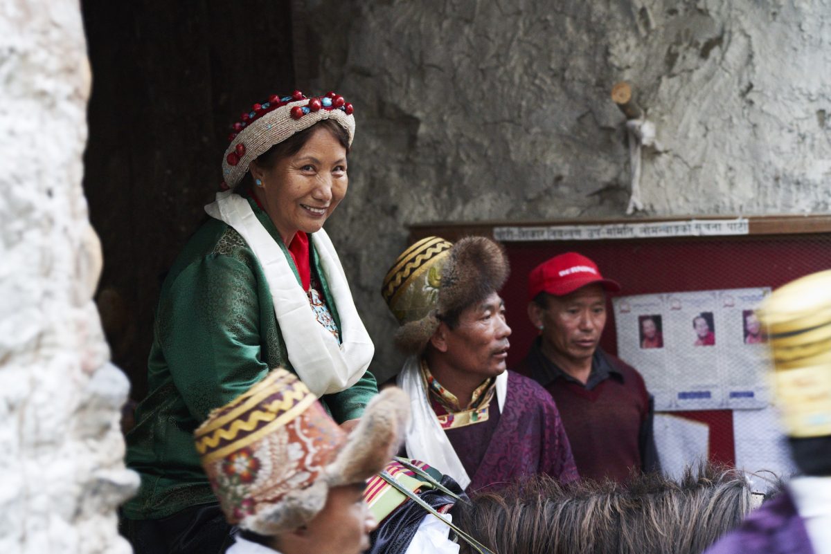 Celebrate the pageantry of the Yartung Horse Festival in the walled city of Lo Manthang, Nepal. The Queen on horseback at the opening ceremony.